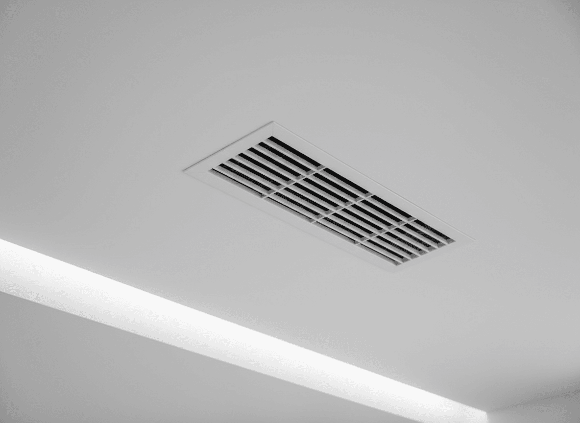 Rejilla de difusión de aire acondicionado integrada en techo blanco